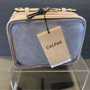 CALPACK NWT/Dustbag Mini Clear Cosmetic Zippered Travel Case.  Stone.